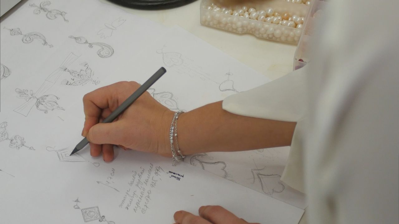 Jewelry designer sketching out a future accessory