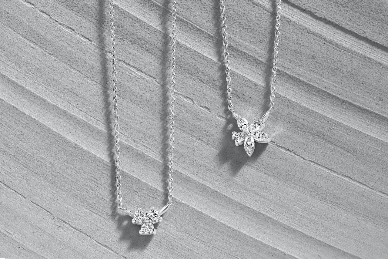 Platinum necklaces on a gray background