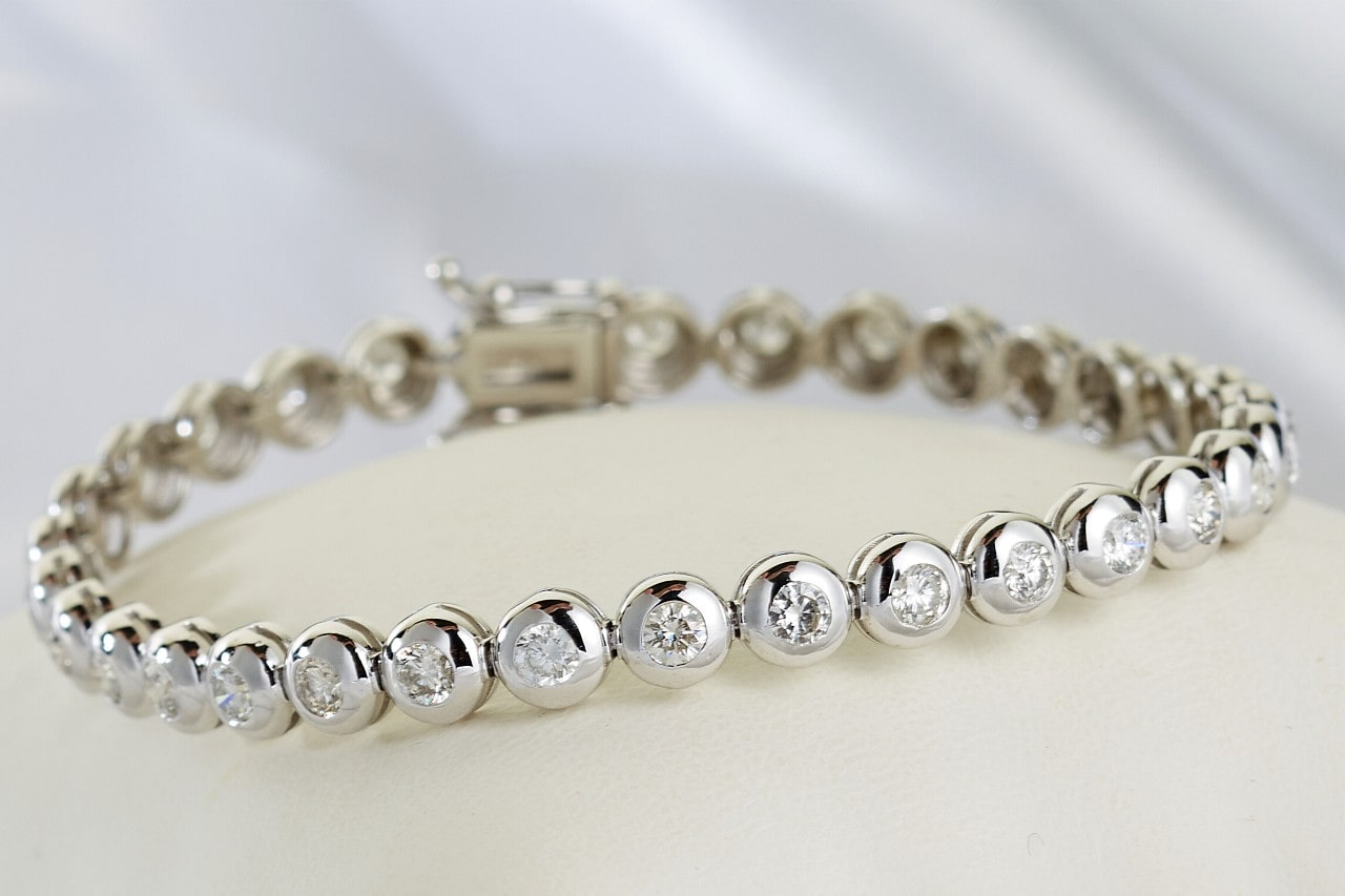 Platinum and diamond bracelet on a white background