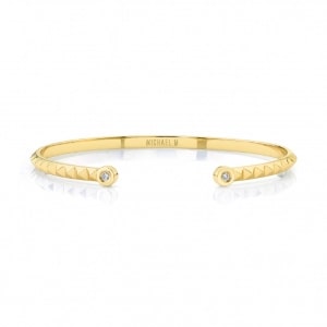 A yellow gold cuff bracelet from Michael M.