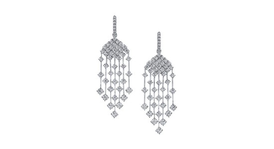 A pair of white gold and diamond chandelier earrings by TDFJ Couture, available at Thom Duma Fine Jewelers.