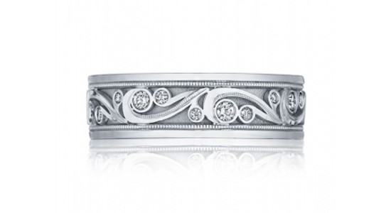  a white gold men’s wedding band with intricate details and diamond accents