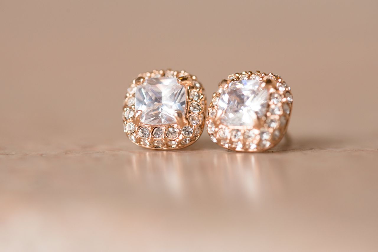 diamond stud earrings on table